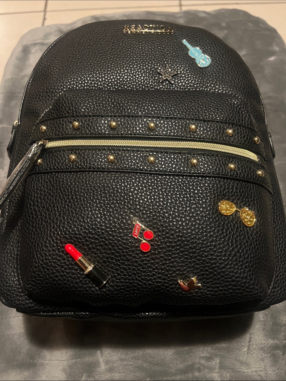 Kenneth Cole Reaction Black Studded Backpack with Enamel Pin Accents
